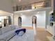 Open-concept living space with hardwood floors, a fireplace, and view of second-story railing at 910 Lilac Arbor Rd, Dacula, GA 30019