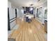 Open-concept living room with hardwood floors, fireplace, and natural light at 910 Lilac Arbor Rd, Dacula, GA 30019