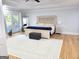 Bright main bedroom with tray ceilings, french doors, and ample space at 910 Lilac Arbor Rd, Dacula, GA 30019