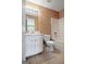 Bathroom featuring a shower-tub, commode, and vanity with white cabinets and tile floors at 204 Eleanor Court, Stockbridge, GA 30281