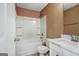 Well-lit bathroom with white tub, shower, toilet, and vanity with white cabinets at 204 Eleanor Court, Stockbridge, GA 30281