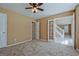 Spacious bedroom features neutral carpet, ceiling fan, and white doors to closets and adjoining rooms at 204 Eleanor Court, Stockbridge, GA 30281