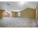 Bonus room is carpeted, warm paint, and has two windows with dormers at 204 Eleanor Court, Stockbridge, GA 30281