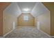 Bonus room features neutral carpet, warm paint and a small dormer window at 204 Eleanor Court, Stockbridge, GA 30281