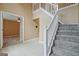 Spacious foyer with tile floors, a staircase, and an open doorway to another room at 204 Eleanor Court, Stockbridge, GA 30281