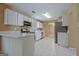 Charming kitchen with white cabinets, stainless steel appliances, and tile flooring at 204 Eleanor Court, Stockbridge, GA 30281