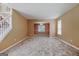 Open living room with neutral carpet, adjoining rooms and staircase at 204 Eleanor Court, Stockbridge, GA 30281