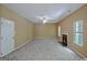 Cozy living room with fireplace, carpet flooring, and natural light at 204 Eleanor Court, Stockbridge, GA 30281