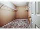 This walk-in closet offers ample storage with wire shelving and plush carpeting at 204 Eleanor Court, Stockbridge, GA 30281