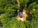 Aerial view showcases a private residence nestled amidst lush greenery, offering serene seclusion and natural beauty at 1783 Cheyenne Trl, Jonesboro, GA 30236