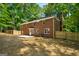 Spacious backyard featuring a brick house and a newly installed fence, perfect for outdoor activities and relaxation at 1783 Cheyenne Trl, Jonesboro, GA 30236