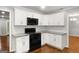Beautiful kitchen featuring stainless appliances, granite countertops, and white cabinetry at 1783 Cheyenne Trl, Jonesboro, GA 30236