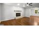Bright living room featuring a fireplace and hardwood floors at 1783 Cheyenne Trl, Jonesboro, GA 30236