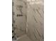 Updated bathroom featuring tiled walls and chrome shower features at 213 Whipporwill Way, Riverdale, GA 30274