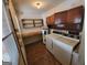 Bright laundry room with washer, dryer, and built-in storage shelves at 213 Whipporwill Way, Riverdale, GA 30274