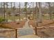 Enjoy the lake view from the backyard with mature trees and a path down to the water at 480 Mitchell Rd, Covington, GA 30014