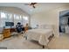Bright bedroom featuring a desk area, large windows, and access to a walk-in closet at 480 Mitchell Rd, Covington, GA 30014