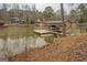 Picturesque covered boat dock with boat, offering direct lake access and recreational opportunities at 480 Mitchell Rd, Covington, GA 30014