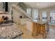 Bright kitchen features granite counters, an island with seating, and stainless steel appliances at 480 Mitchell Rd, Covington, GA 30014