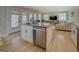 Open kitchen showcases a central island, stainless steel dishwasher, and easy access to the living area at 480 Mitchell Rd, Covington, GA 30014