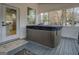 This covered patio has a hot tub and plenty of privacy at 480 Mitchell Rd, Covington, GA 30014