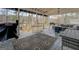 This spacious patio features a grill, hammock, and outdoor furniture for relaxing and entertaining at 480 Mitchell Rd, Covington, GA 30014