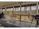 Enjoy a hammock, grill and waterfront views on this covered patio at 480 Mitchell Rd, Covington, GA 30014