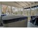 This covered patio has a hot tub with waterfront views at 480 Mitchell Rd, Covington, GA 30014