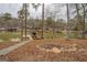 Scenic waterfront view featuring a covered dock, lake, and lush trees, enhancing the property's appeal at 480 Mitchell Rd, Covington, GA 30014