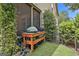 Outdoor barbecue area with built-in grill on a lush, green lawn at 135 Adam Ridge Ln, Fayetteville, GA 30214