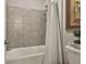 Bright bathroom with a shower/tub combination at 135 Adam Ridge Ln, Fayetteville, GA 30214