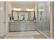 Stylish bathroom featuring double vanity with granite counters and glass enclosed shower at 135 Adam Ridge Ln, Fayetteville, GA 30214