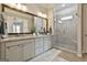 Chic bathroom with double vanity, granite countertops and glass enclosed shower at 135 Adam Ridge Ln, Fayetteville, GA 30214