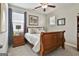 Cozy bedroom with a queen-sized bed, nightstand, and neutral decor at 135 Adam Ridge Ln, Fayetteville, GA 30214