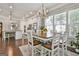 Bright dining area adjacent to the kitchen, features a stylish chandelier, and connects seamlessly to the kitchen at 135 Adam Ridge Ln, Fayetteville, GA 30214
