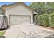 Attached two-car garage with concrete driveway at 135 Adam Ridge Ln, Fayetteville, GA 30214