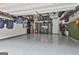 Organized garage with ample storage, including shelves, cabinets, and wall-mounted racks at 135 Adam Ridge Ln, Fayetteville, GA 30214