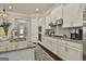 Modern kitchen featuring white cabinets, stainless steel appliances, and granite countertops at 135 Adam Ridge Ln, Fayetteville, GA 30214