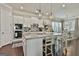 Bright and airy kitchen with white cabinets, stainless appliances, and a large center island at 135 Adam Ridge Ln, Fayetteville, GA 30214