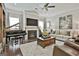 Elegant living room featuring a fireplace, a grand piano, and stylish decor, perfect for entertaining and relaxation at 135 Adam Ridge Ln, Fayetteville, GA 30214