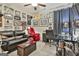Eclectic living room with black leather seating, many framed pictures, and a glass top desk at 135 Adam Ridge Ln, Fayetteville, GA 30214