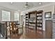 Spacious loft with hardwood floors and a custom bookshelf surrounding a television at 135 Adam Ridge Ln, Fayetteville, GA 30214