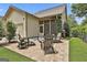 Backyard patio features brick pavers, outdoor seating, a screened porch and a built in barbecue at 135 Adam Ridge Ln, Fayetteville, GA 30214
