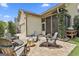 Backyard patio features brick pavers, outdoor seating, a screened porch and a built in barbecue at 135 Adam Ridge Ln, Fayetteville, GA 30214