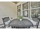 Covered patio with outdoor seating, perfect for enjoying a meal outside at 135 Adam Ridge Ln, Fayetteville, GA 30214
