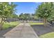 Well-maintained community tennis courts surrounded by lush landscaping, perfect for active recreation at 135 Adam Ridge Ln, Fayetteville, GA 30214