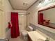 Bathroom with a red shower curtain, tile floor, and a single sink vanity at 4402 Auburn Hills Drive, Stone Mountain, GA 30083