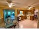 Functional kitchen with essential appliances, eat-in breakfast nook, and a view into the adjacent room at 4402 Auburn Hills Drive, Stone Mountain, GA 30083