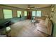 Comfortable living room with ample natural light, neutral carpet, and views of the outdoors at 4402 Auburn Hills Drive, Stone Mountain, GA 30083