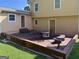 Outdoor brick patio features space for dining, relaxing, and entertaining at 4402 Auburn Hills Drive, Stone Mountain, GA 30083
